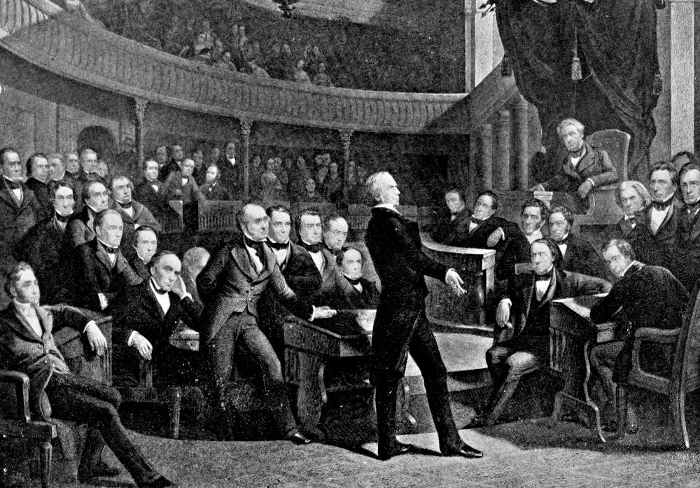 A 1900 illustration depicts the U.S. Senate in 1850, as Sen. Henry Clay delivers a speech. Seated in the second row behind him is Daniel Webster, and on the far right is John Calhoun.