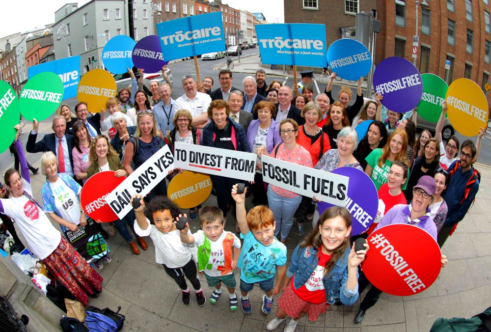People celebrate July 12, 2018, after the passage of the Fossil Fuel Divestment Bill in Ireland. (Mark Stedman) People celebrate July 12, 2018, after the passage of the Fossil Fuel Divestment Bill in Ireland. (Mark Stedman)