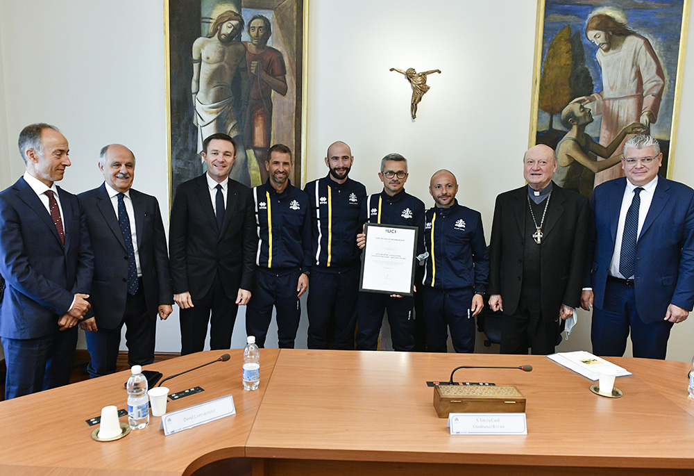 David Lappartient, third from left, presents official certification of the Athletica Vaticana sports club as a member of the International Cycling Union, Oct. 28 at the Vatican. (Courtesy of Athletica Vaticana)