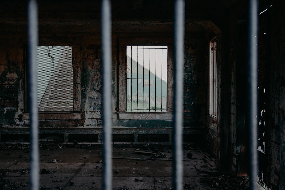 View of prison bars (Unsplash/Christina Boemio)