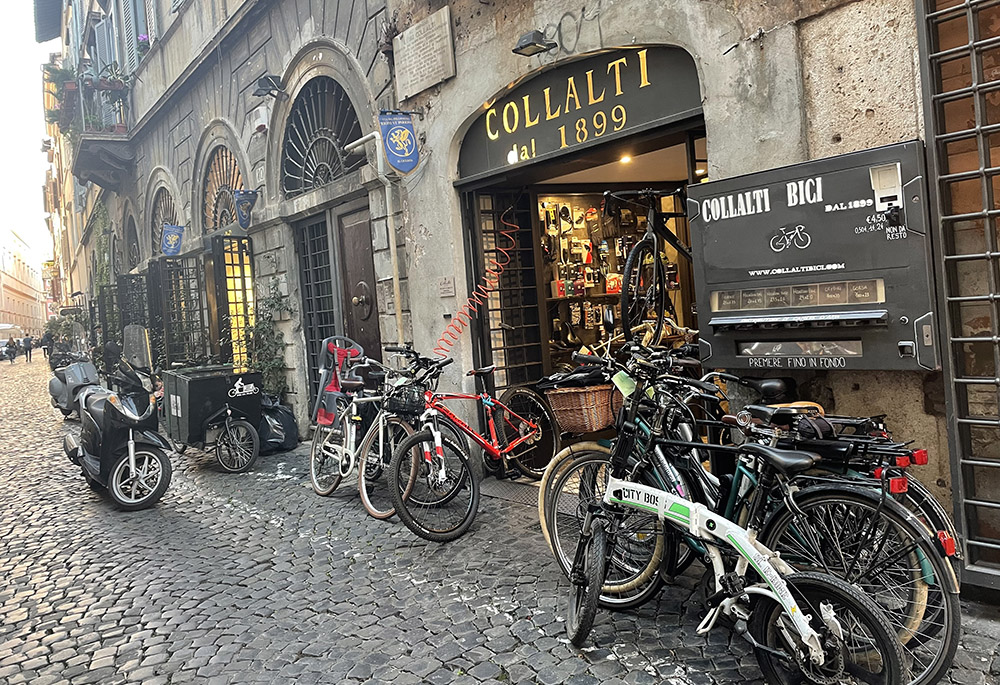 The bicycle shop Collalti's at the Via del Pellegrino in Rome has been selling and repairing bikes since 1889. A new Vatican cycling team was accepted as a member of International Cycling Union in September 2021 at the Vatican. (NCR/Christopher Whit