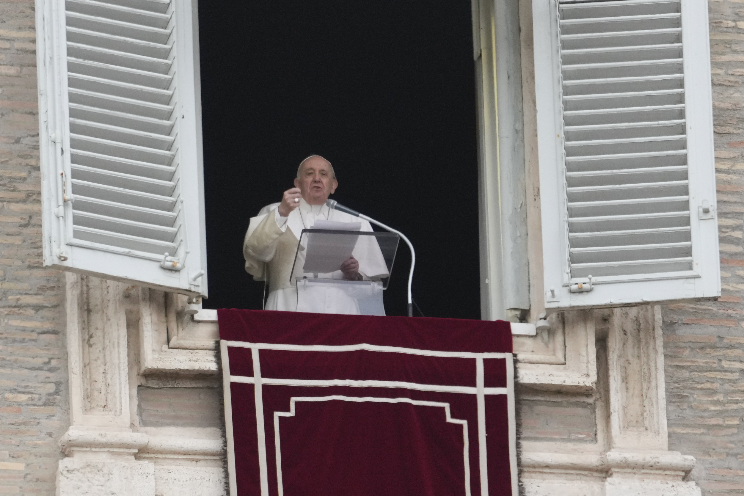 Pope Francis delivers the Angelus noon prayer from his studio window overlooking St. Peter's Square, at the Vatican, Sunday, Feb. 20, 2022. (AP Photo/Gregorio Borgia)