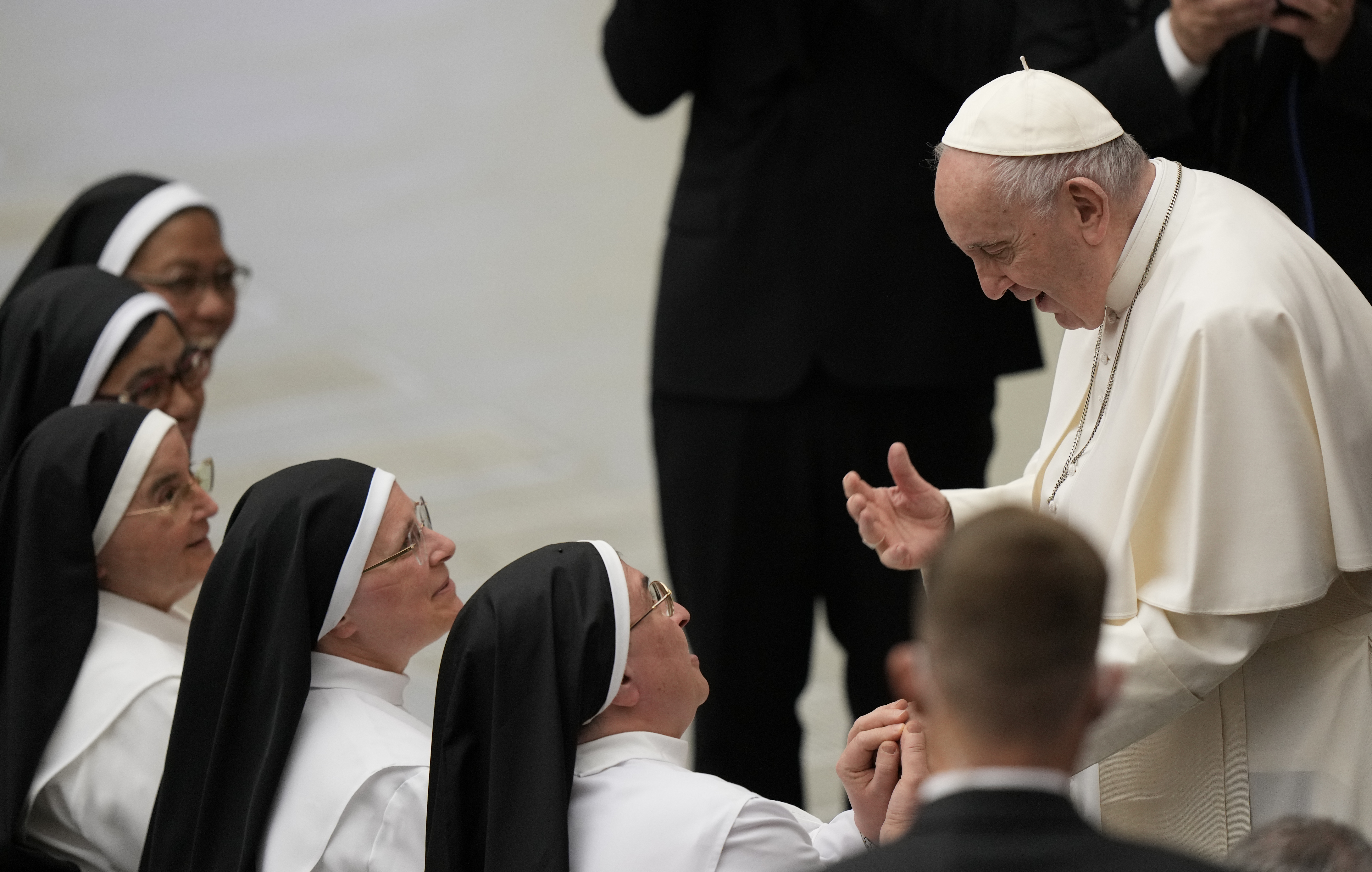 Pope Francis greets nuns at the end of his weekly general audience in the Paul VI Hall at The Vatican, Wednesday, March 30, 2022. (AP Photo/Andrew Medichini)