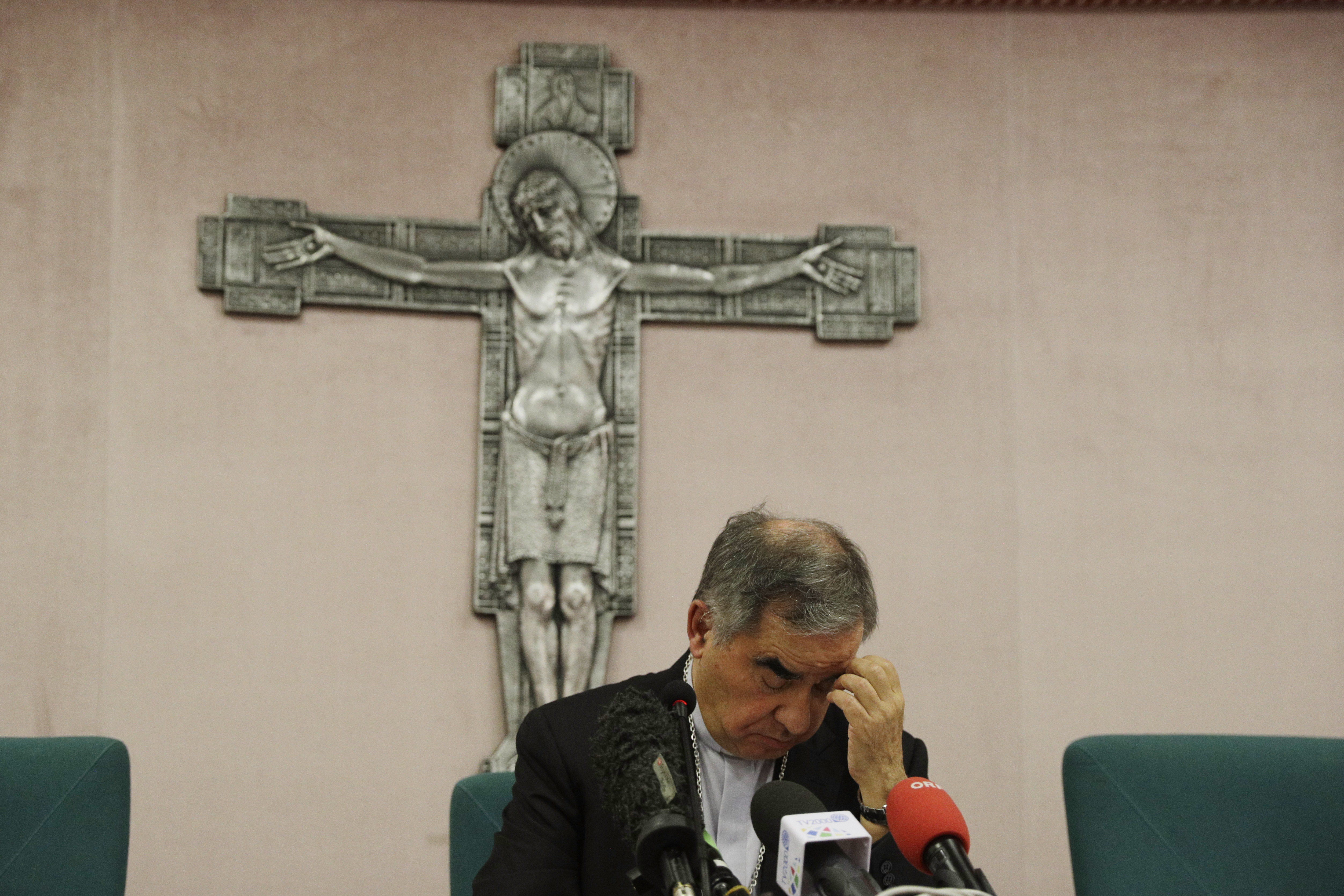Cardinal Angelo Becciu talks to journalists during press conference in Rome, in this Friday, Sept. 25, 2020. (AP Photo/Gregorio Borgia)