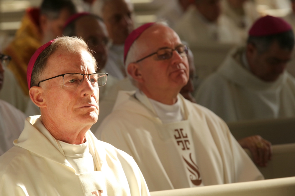 Archbishop John Wester of Santa Fe, New Mexico, listens to the homily during Mass at Mundelein Seminary Jan. 3 at the University of St. Mary of the Lake in Illinois, near Chicago. (CNS/Bob Roller)
