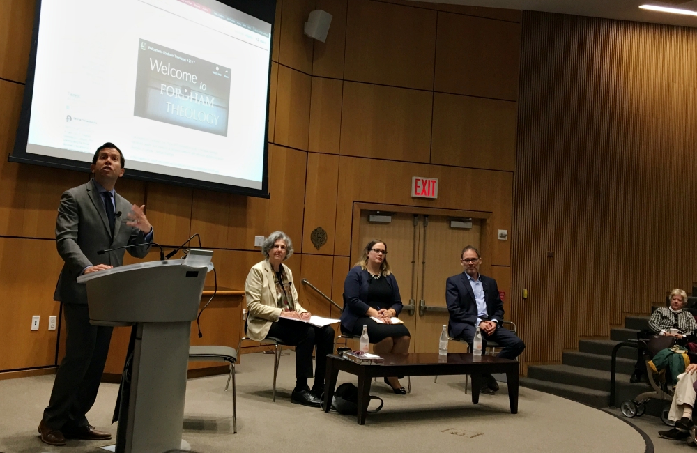 J. Patrick Hornbeck II, chair of the Theology Department at Fordham University, introduces (from left) Phyllis Zagano, Meghan Clark and George Demacopoulos, panelists for the symposium on women deacons Oct. 22 in New York. (NCR photo/Sarah Salvadore)