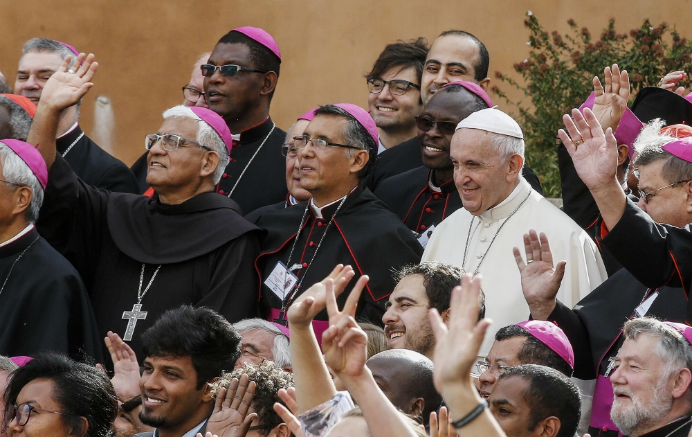 Pope Francis poses for a group photo with bishops and participants at the Synod of Bishops on young people at the Vatican Oct. 27, 2018. (CNS/EPA/Fabio Frustaci) Pope Francis poses for a group photo with bishops and participants at the Synod of Bishops on young people at the Vatican Oct. 27, 2018. (CNS/EPA/Fabio Frustaci)