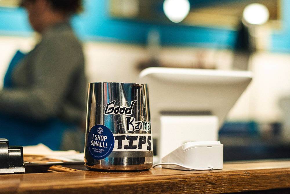 Photo illustration of a tip jar (Unsplash/Dan Smedley)