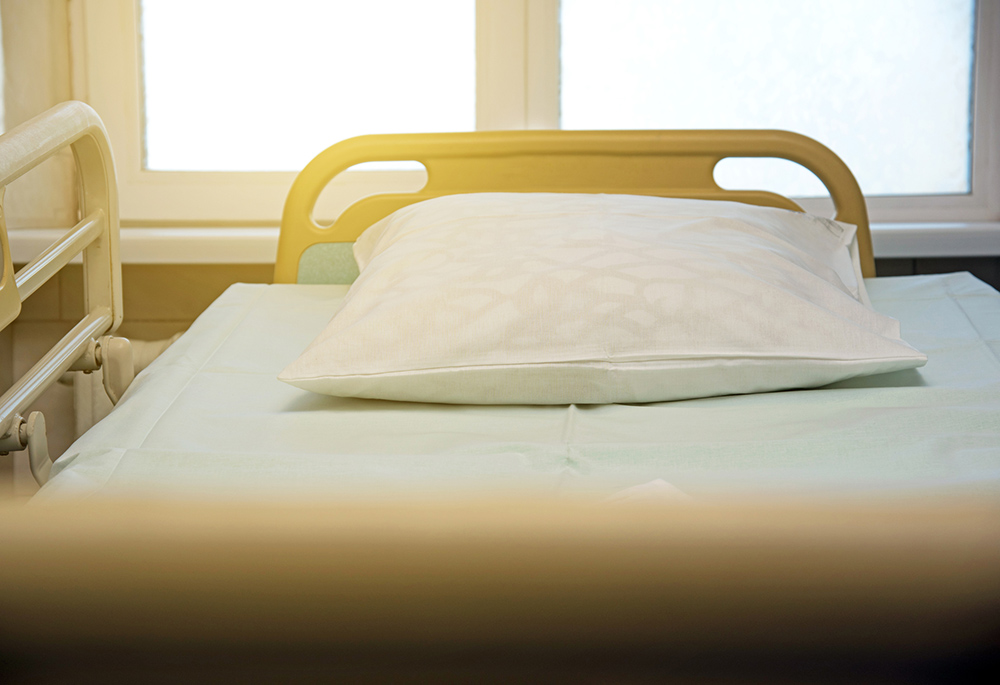 Hospital bed (Unsplash/Andrii Vatsyk)