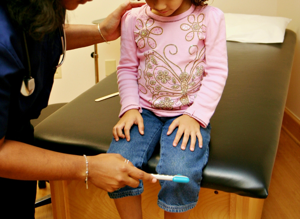 Child at the doctor's office (Dreamstime/Rmarmion)