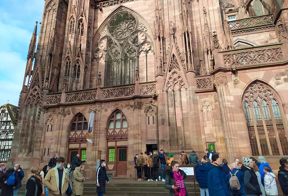 People are seen near Notre Dame Cathedral in Strasbourg, France, Dec. 12, 2021. Though France is still a Catholic country in some ways, COVID-19 lockdowns and a shocking report on abuse in the church have led to emptier and emptier churches on Sundays.