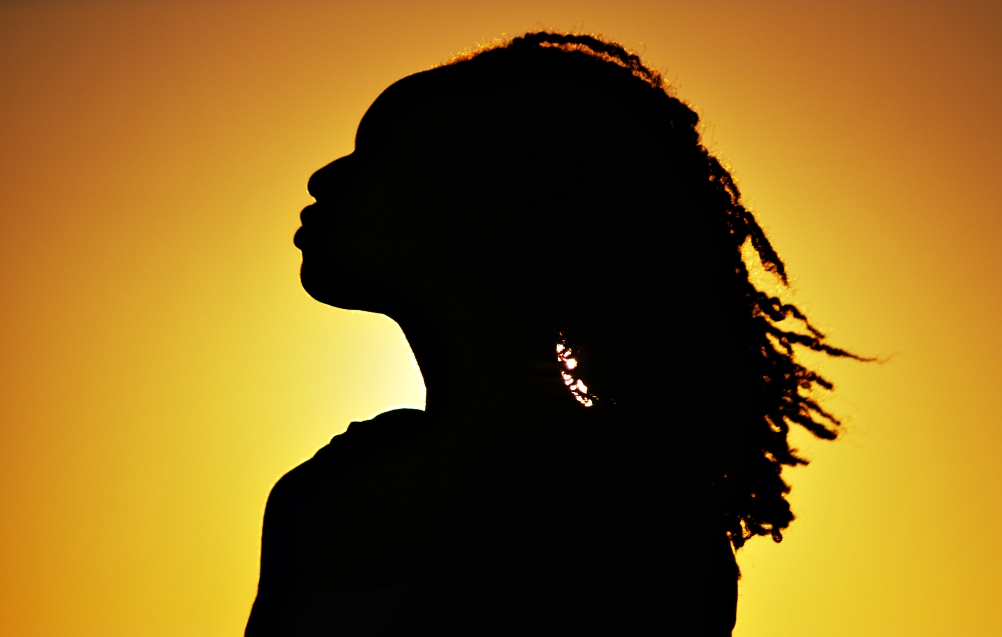 Black woman in silhouette (Dreamstime/Mark Adams)
