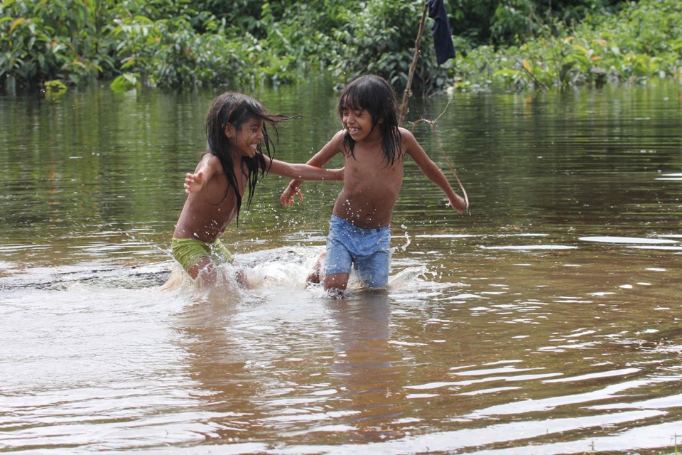 Two Urarina Indigenous girls play in the Urituyacu River in northeastern Peru. (Photo/Barbara Fraser)