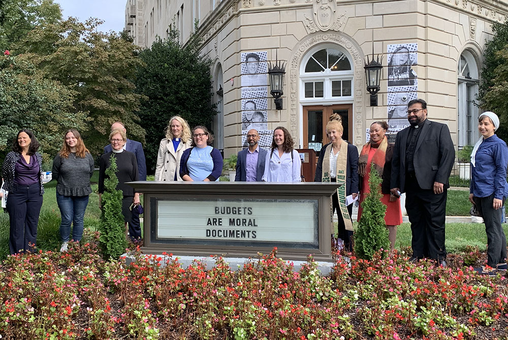 Faith leaders gather in prayer and reflection Sept. 23 in Washington Faith leaders and staff gather in prayer and reflection Sept. 23 in front of the United Methodist Building in Washington to call on lawmakers to push for the $3.5 trillion human infrastructure bill. (NCR/Melissa Cedillo)
