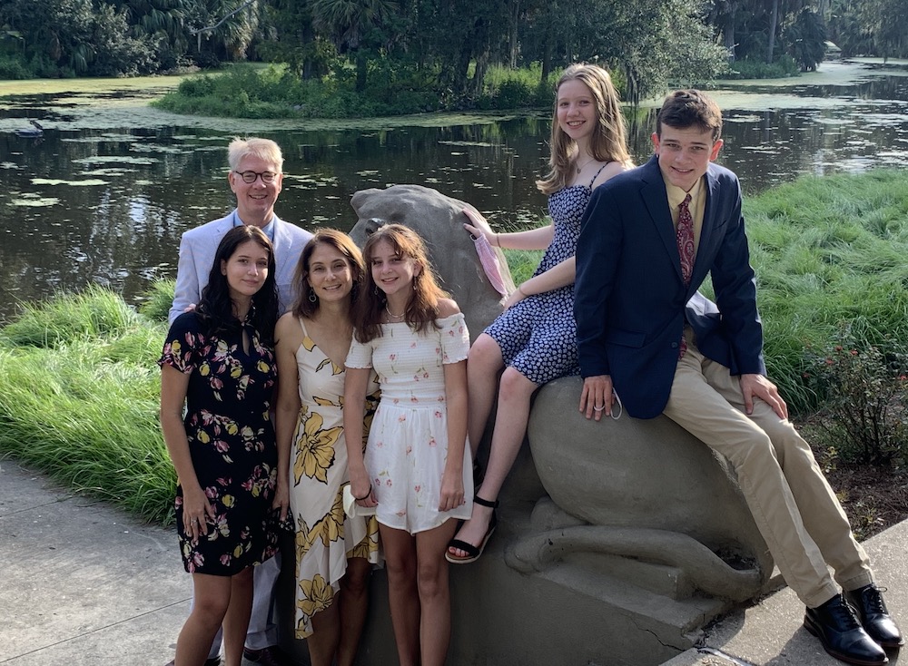 Masks in hand, Dr. Jennifer Avegno, front row, second from left, and her family pose together in September: husband Kurt Weigle and children, from left, Lucy, 15, Gigi, 11, Eva, 14, and Joey, 17 (Provided photo)