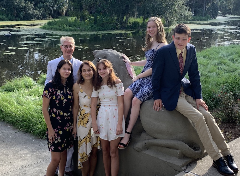 Masks in hand, Dr. Jennifer Avegno, front row, second from left, and her family pose together in September: husband Kurt Weigle and children, from left, Lucy, 15, Gigi, 11, Eva, 14, and Joey, 17 (Provided photo) Masks in hand, Dr. Jennifer Avegno, front row, second from left, and her family pose together in September: husband Kurt Weigle and children, from left, Lucy, 15, Gigi, 11, Eva, 14, and Joey, 17 (Provided photo)