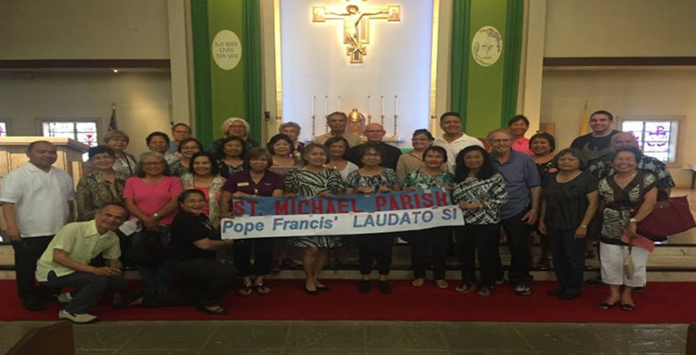 Fr. Emmet Farrell, center, poses with members of St. Michael Catholic Church, in San Diego. As the director of creation care ministry, Farrell promotes Pope Francis' encyclical Laudato Si' within parishes in the Diocese of San Diego, and helps form creati