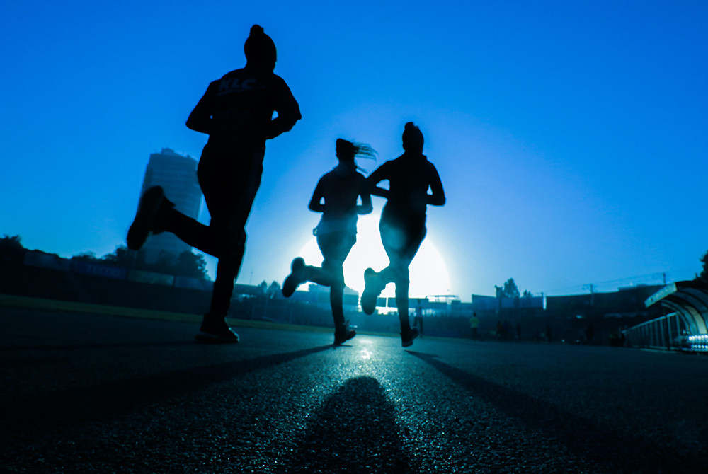 Running photo illustration (Unsplash/Fitsum Admasu)