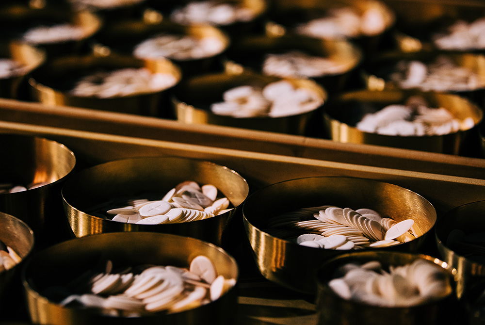 Photo illustration of Communion wafers (Unsplash/Grant Whitty)