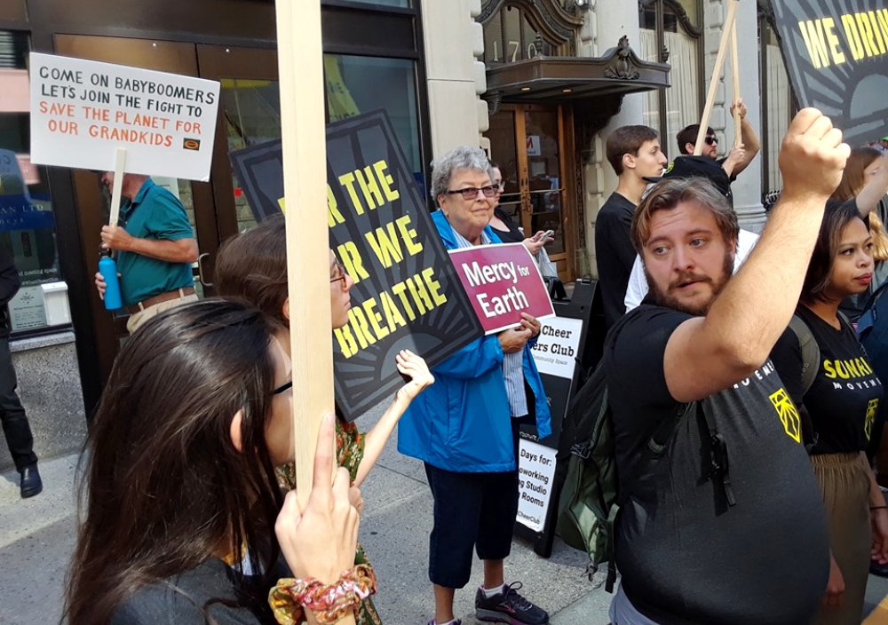 Mercy Sr. Mary Pendergast, center, joins the Sunrise Movement at a demonstration Sept. 9 in Rhode Island urging U.S. Sen. Sheldon Whitehouse and Gov. Gina Raimondo to support the Green New Deal. (Provided photo)