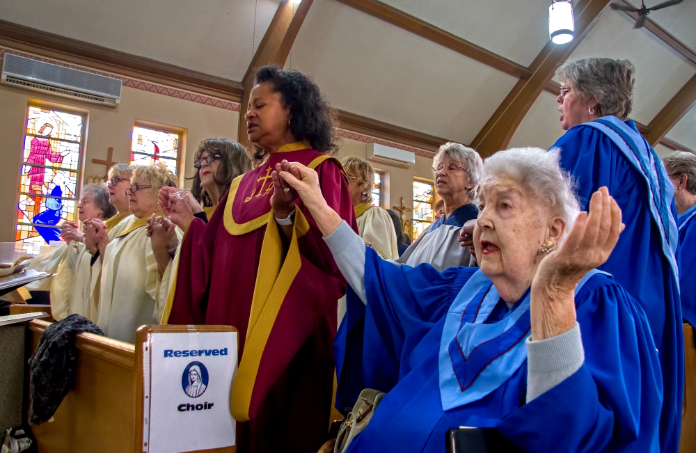 A choir combined from all of the churches in the Catholic Community of Flint sings during the dedication of Flint, Michigan, to the Virgin Mary at St. Mary Church May 13. (Gary Pearce)