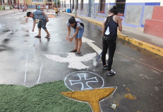 Young people in the Peruvian town of Nauta prepare street paintings made of colored sawdust in preparation for Holy Week processions. (Barbara Fraser)