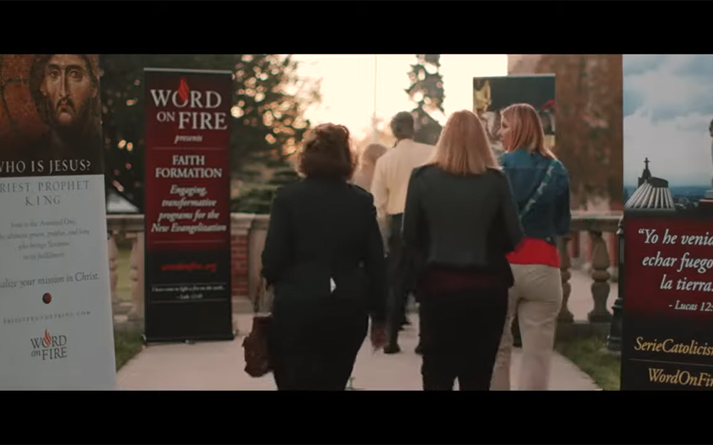 People are seen walking to a Word on Fire event in a promotional video on the Word on Fire Institute website. (NCR screengrab/YouTube/Word on Fire Institute)