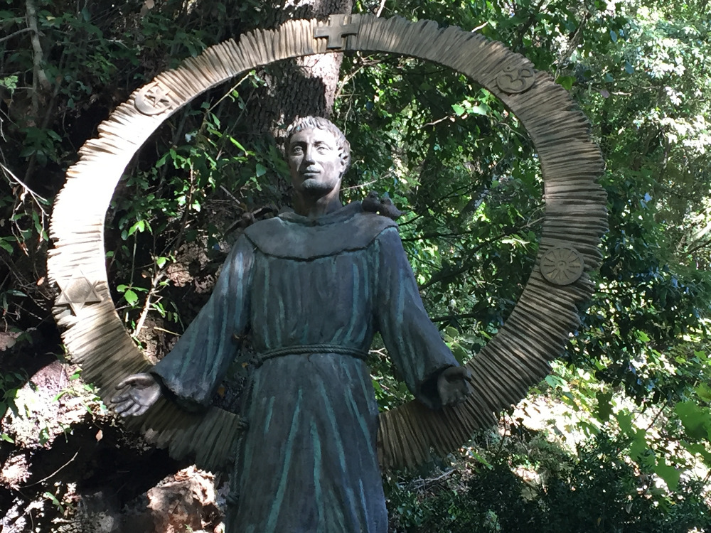 An image of St. Francis greets visitors to the hillside cloister where he prayed outside of Assisi, Italy. (Barbara Fraser)