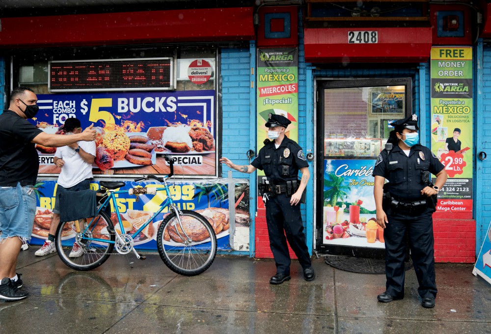 Camden County Police Officers Alexander Baldwin and Natalie Perez patrol on the streets of Camden, New Jersey, June 11. (Newscom/Reuters/Jessica Kourkounis)