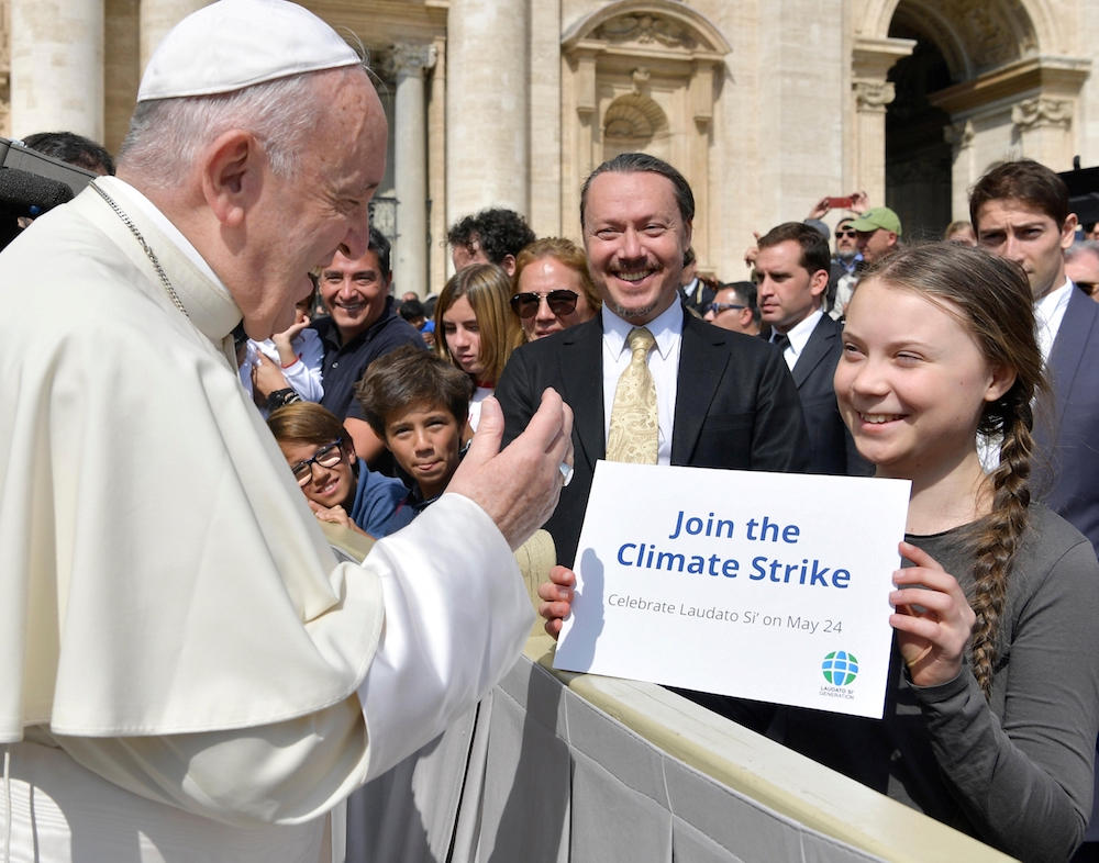Pope Francis greets Swedish climate activist Greta Thunberg during his general audience in St. Peter's Square at the Vatican April 17, 2019. (CNS photo/Yara Nardi, Reuters)