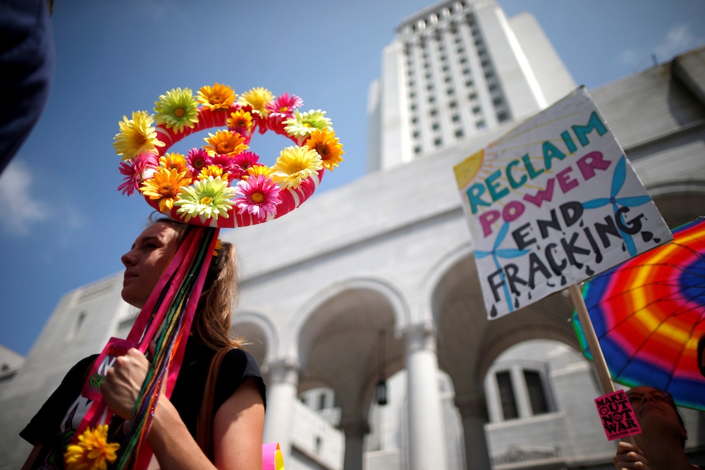 Protesters demonstrate against fracking and neighborhood oil drilling in Los Angeles May 14, 2016. Much of the oil industry's political power lies in the century-old American Petroleum Institute. (CNS photo/Lucy Nicholson, Reuters)
