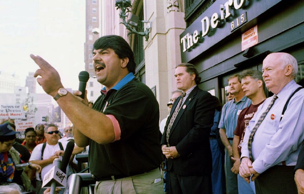 Richard Trumka, then AFL-CIO secretary treasurer, speaks to newspaper strikers and supporters at rally in front of the Detroit News building in August 1996. Bishop Thomas J. Gumbleton, Trumka, AFL-CIO president John Sweeney (right) and several others were