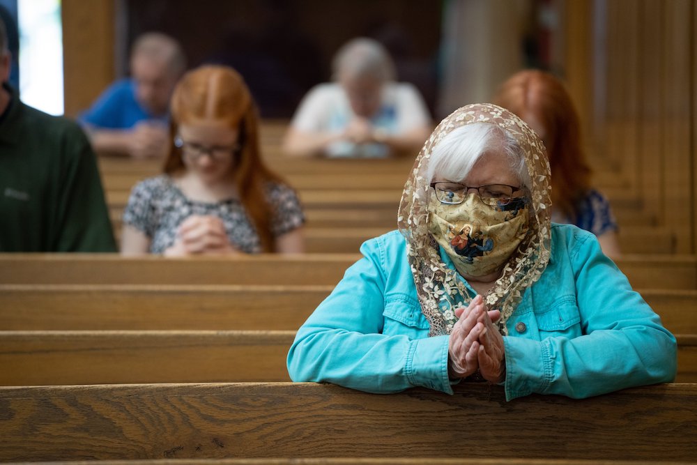 Parishioners pray after receiving communion at St. Louis Catholic Church in Batesvill, Indiana. The proportion of Americans who identify as white Catholics has dropped from six in 10 in 1996 to four in 10 today, according to a new survey. (CNS photo/Katie