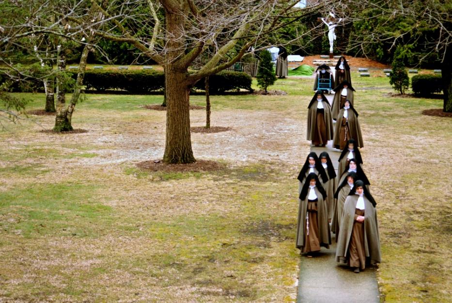 Poor Clare Colettine nuns walk back to the monastery after a funeral service, in 2010, for a cloistered nun who served in WWII before she joined an active order of nuns, and then transferred to the cloistered order at the Corpus Christi Monastery in Rockford, Ill. (© Abbie Reese)