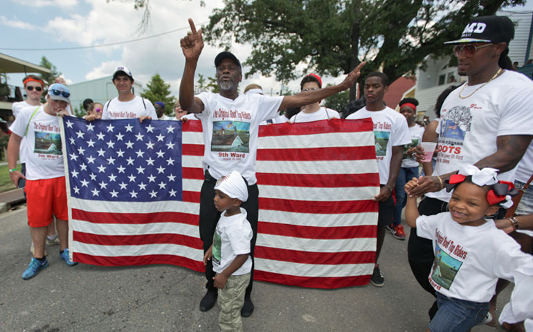 On Aug. 29, 2015, in New Orleans' Lower 9th Ward, Robert Green leads survivors of Hurricane Katrina in a second-line parade to commemorate the 10th anniversary of the storm. (Newscom/Sipa USA/Charlie Varley)
