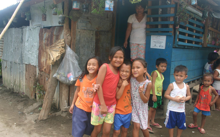 In Palo, Philippines, 68 percent of schoolchildren are infected with schistosomiasis. In this neighborhood, almost every adult has tested positive for the parasite, which is spread through skin contact with contaminated water. (Photos by Joanna Gardner)