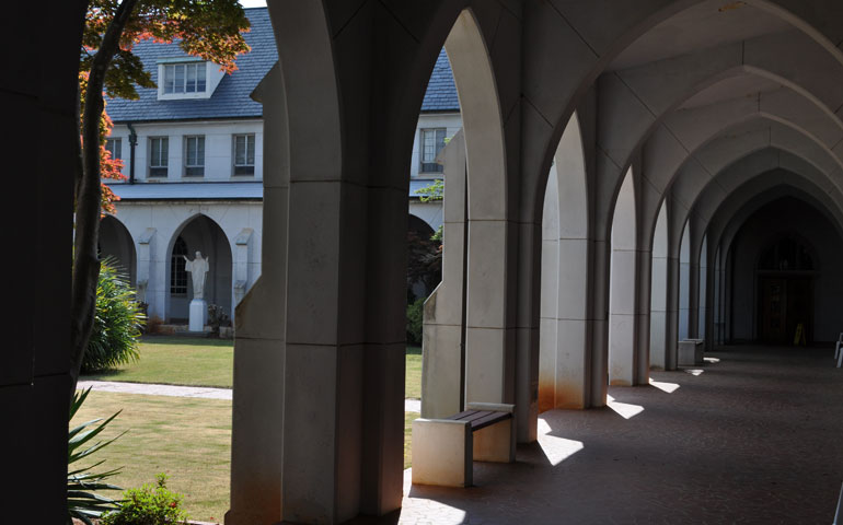 A view of the cloister garden and a statue of Jesus from one of the walkways at Holy Spirit Monastery in Conyers, Ga. (Wikimedia Commons/NancyHeise)