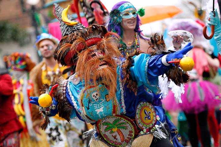 Members of the Mondo Kayo Social and Marching Club parade down St. Charles Avenue on Mardi Gras in New Orleans March 4, 2014. (Newscom/Reuters/Jonathan Bachman)