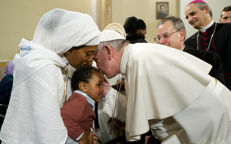 Pope Francis kisses a child during a pastoral visit to the Basilica of the Sacred Heart of Jesus in Rome Jan. 19. (CNS/Reuters/L'Osservatore Romano)