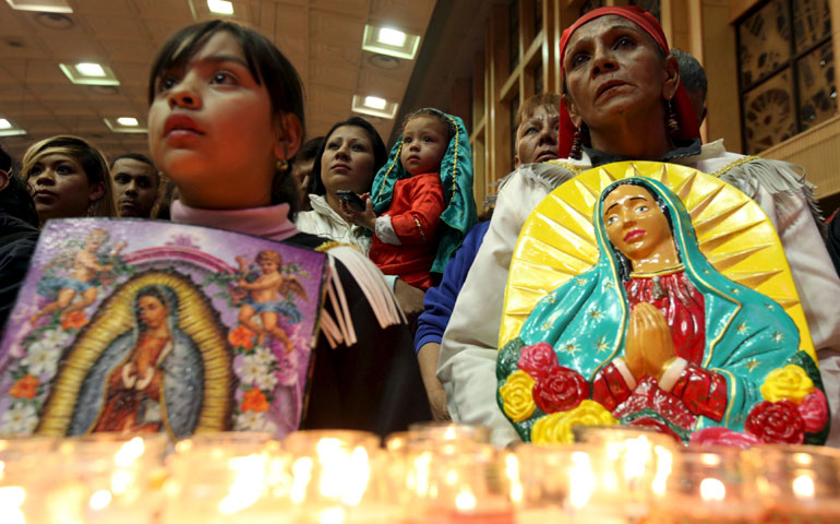 Pilgrims hold images of Our Lady of Guadalupe during an annual pilgrimage in her honor at the cathedral in Ciudad Juárez, Mexico, Dec. 11. (CNS/Reuters/Jose Luis Gonzalez)