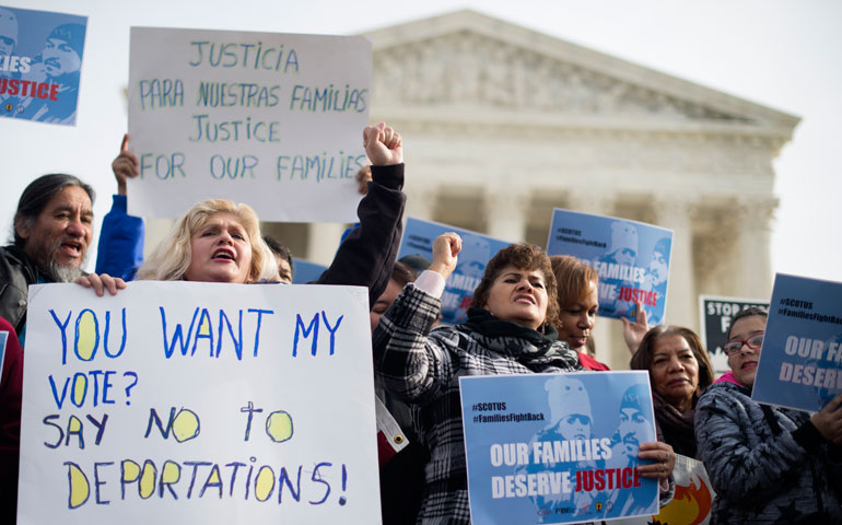 Immigration advocates rally outside the U.S. Supreme Court Jan. 15 in Washington. (CNS/EPA/Michael Reynolds)