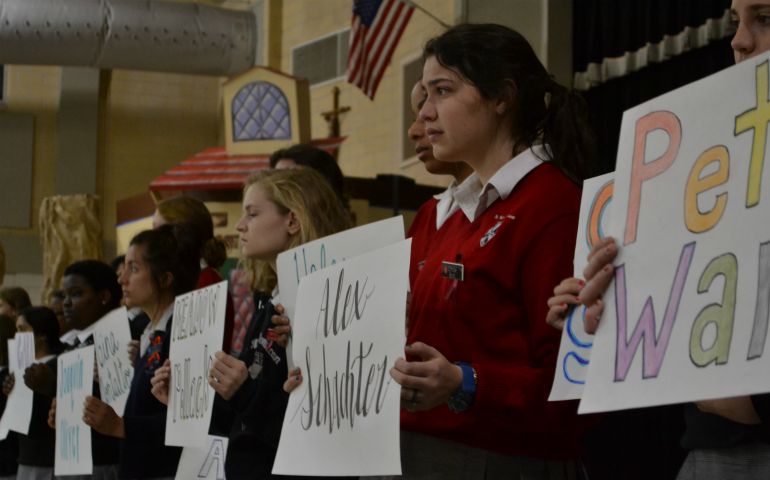 Students at St. Mary's Dominican High School in New Orleans gather March 14 for 17 minutes to pray and remember the 17 students and faculty members killed in a Feb. 14 shooting in Parkland, Florida. Students carried signs with the names of those who died, and the Hail Mary was recited after each name was read. The school is run by the Dominican Sisters of Peace. (Courtesy of the Dominican Sisters of Peace)