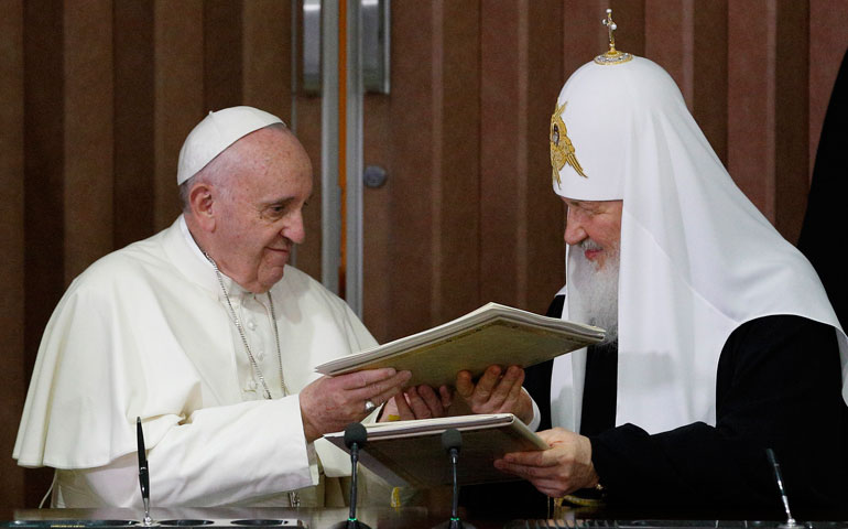 Pope Francis and Russian Orthodox Patriarch Kirill of Moscow exchange copies after signing a joint declaration during a meeting in Havana Feb. 12. (CNS photos/Paul Haring)