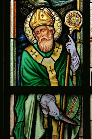 St. Patrick is depicted in a stained-glass window at St. Peter Chanel Church in Roswell, Ga. (CNS/Georgia Bulletin/Michael Alexander)