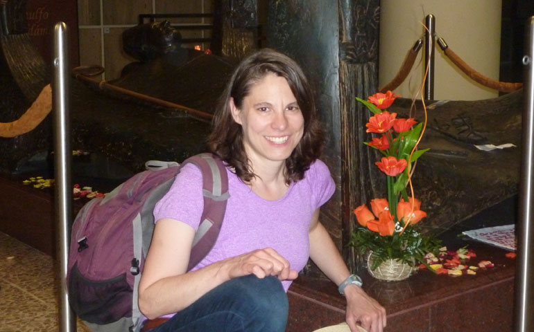 Cinnamon Sarver at Archbishop Oscar Romero's tomb at the Metropolitan Cathedral of San Salvador in May 2015