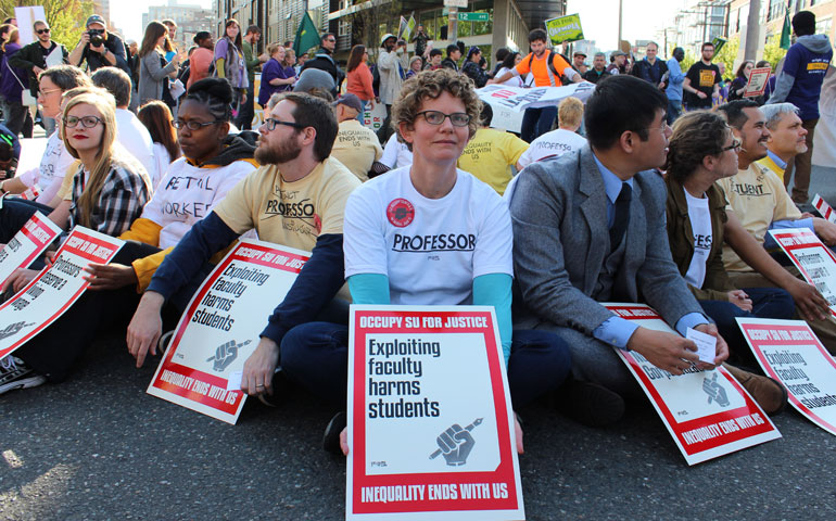 Supporters of unionization of adjunct faculty at Seattle University stage a sit-in April 15, 2015, on a street north of the Jesuit campus. More than 20 people were arrested for civil disobedience. (Courtesy of SEIU 925)