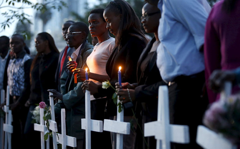 People attend a memorial vigil in Nairobi, Kenya, April 7, 2015, for the 148 people killed in an April 2 attack by al-Shabab militants on Garissa University College. (CNS/Reuters/Goran Tomasevic)