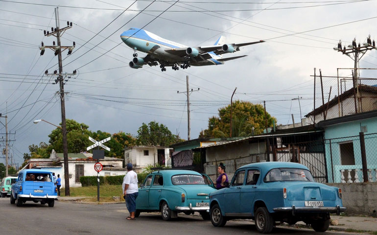 Air Force One carrying U.S. President Barack Obama flies over a Havana neighborhood in Cuba as it approaches the runway March 20. (CNS/Reuters/Alberto Reyes)