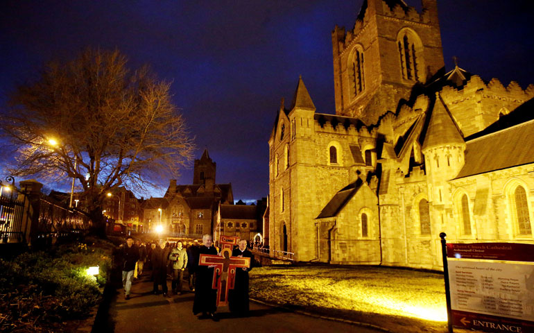 Catholic Archbishop Diarmuid Martin, right, carries a cross with Church of Ireland Archbishop Michael Jackson during a Good Friday procession in Dublin March 29. (AP/Niall Carson)