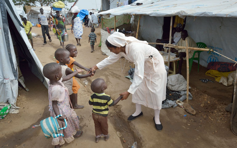 Sr. Amala Francis, a member of the Daughters of Mary Immaculate, greets children inside a United Nations camp for internally displaced families in Juba, South Sudan, April 1. (Paul Jeffrey)